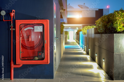 Fire Safety Concept, Fire extinguisher and fire hose reel in public building corridor