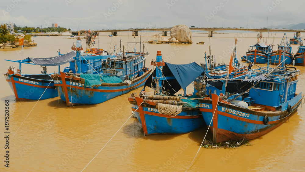 Vietnam. Fishing boats with red flags in Nha Trang,