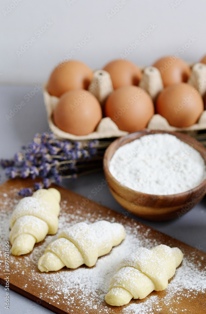 Baking Ingredients for Cooking Croissants. Dough, Eggs, White Sugar, Flour, Milk, Oil Butter. Preparation, Lavender Flowers. Kitchen Cuisine Table Grey Background, Homemade