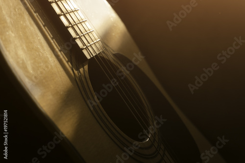  acoustic guitar in the light of the Sun