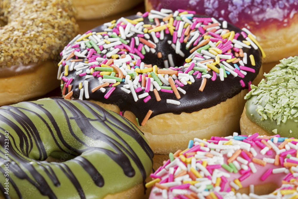 Close up of colorful and delicious donuts
