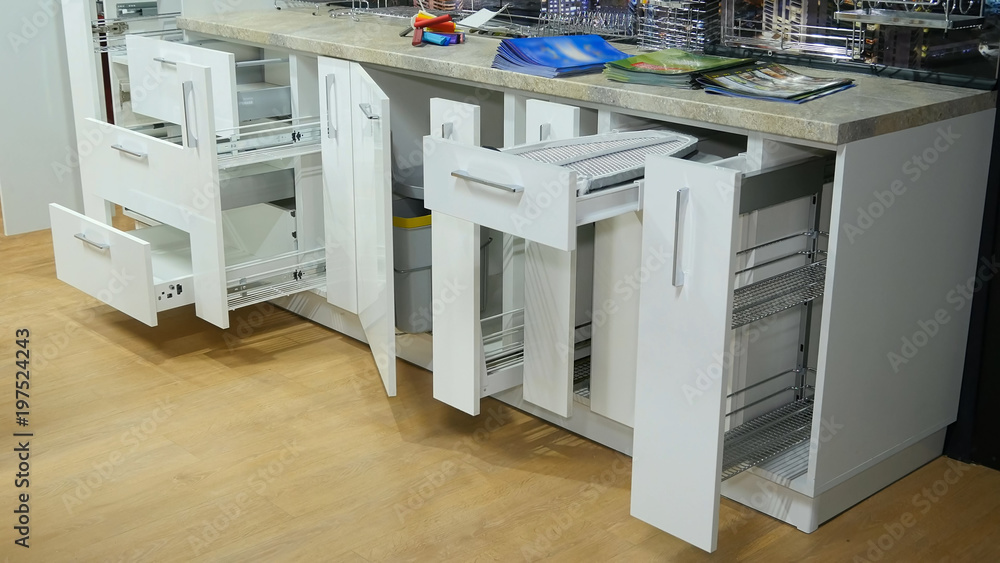 Kitchen white furniture. Pull-out cabinets white color. Kitchen white furniture. Pull-out cabinets white color.