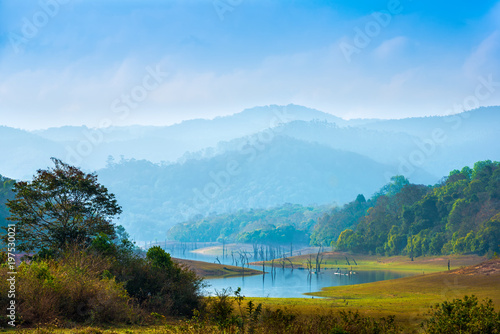 beautiful landscape at  mystical day  with mountains and lake, travel background, Periyar National Park, Kerala, India photo