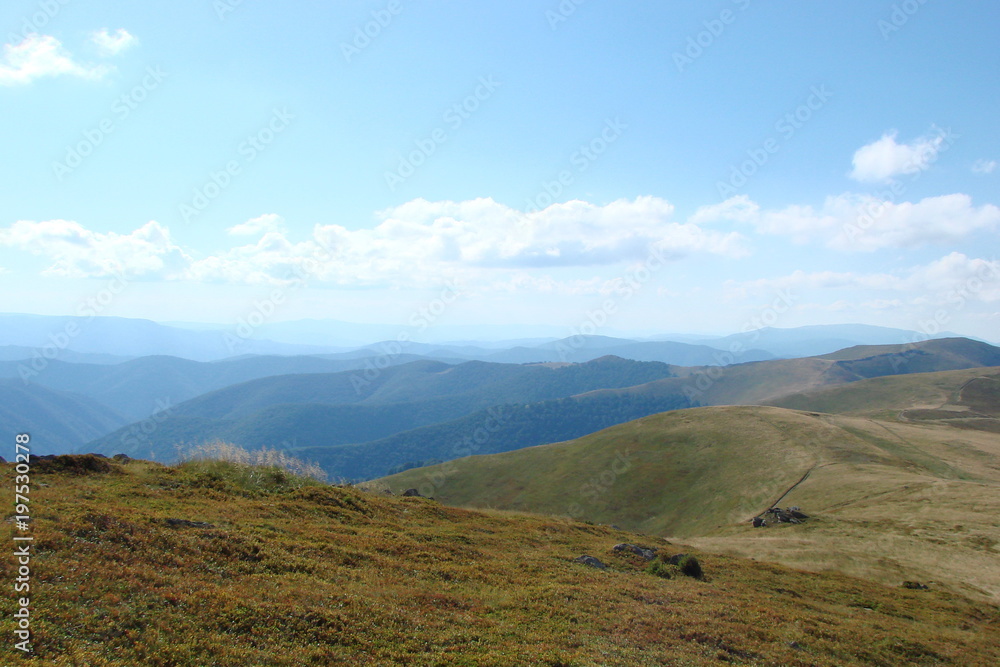 The landscape of the Carpathian mountain range from the height of its peak near the clouds.