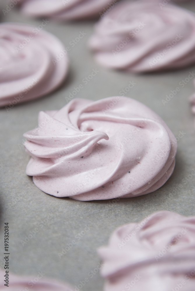 Marshmallow, Meringue, Zephyr over Baking Paper ready for Drying. Pink Dessert with Strawberry. Step by Step process. Marshmallow, Meringue, Zephyr over Baking Paper ready for Drying. Pink Dessert with Strawberry. Step by Step process.