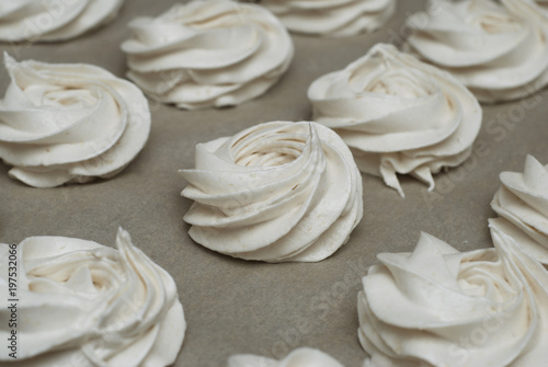 White Marshmallow, Meringue, Zephyr over Baking Paper ready for Drying. Step by Step process.