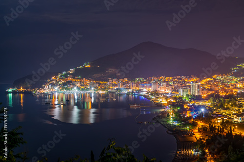 A picturesque panorama of the night city from the top of the mountain.