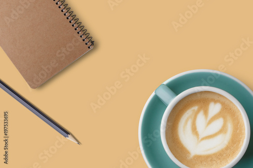 Office desk working space - Flat lay top view mockup photo of working space with coffee up and notebook on pastel background. Working desk concept on pastel   olor background.