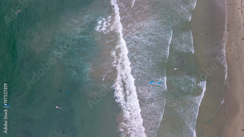Downward aerial view of Surfers in the ocean