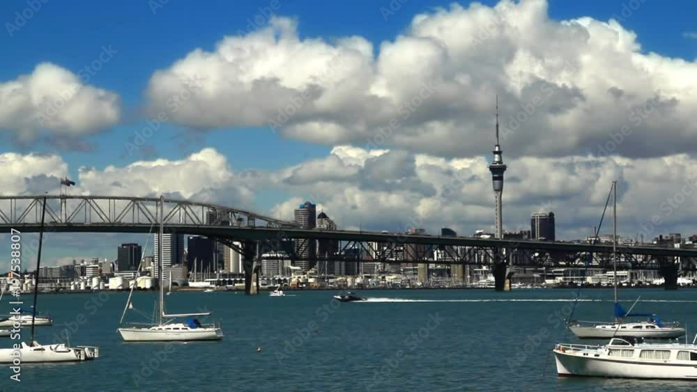 Auckland, New Zealand: Skytower, Harbour Bridge, central business district and boats on the Waitemata harbor. Auckland, New Zealand: Skytower, Harbour Bridge, central business district and boats on the Waitemata harbor.