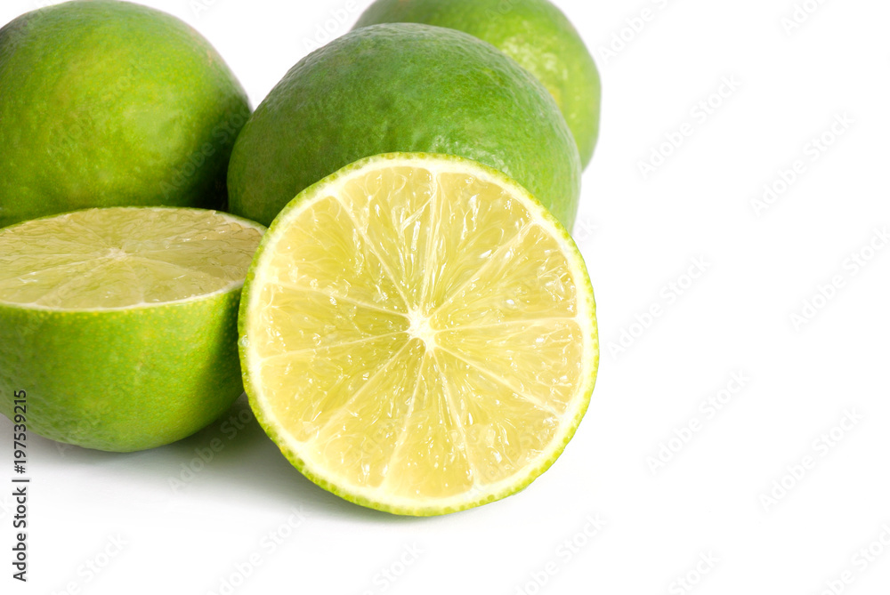 Green lemon with half on white background Green lemon with half on white background