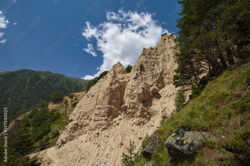 Movement of clouds and water flows in a stormy river in the Caucasus mountains in summer