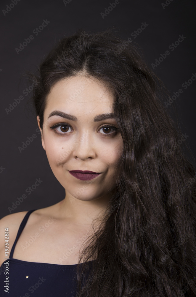 Portrait of a girl on a dark background. Portrait of a girl on a dark background.
