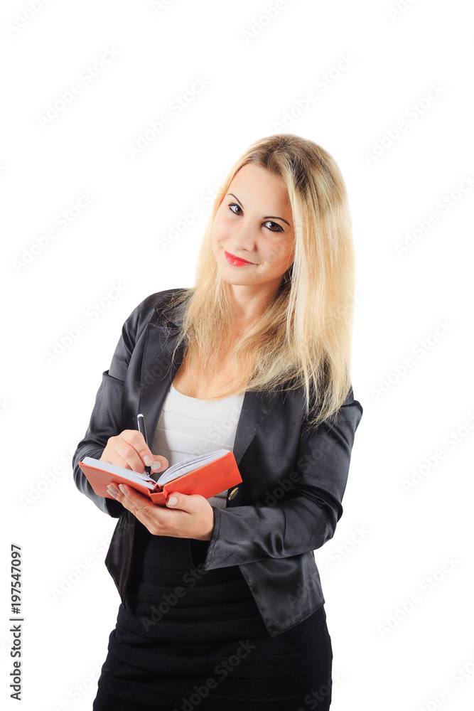girl in business outfit writes in orange notepad girl in business outfit writes in orange notepad