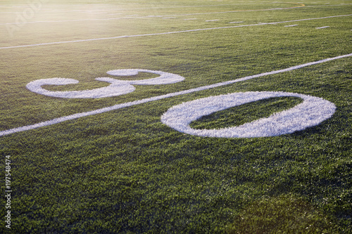 Thirty yard line on green football field
