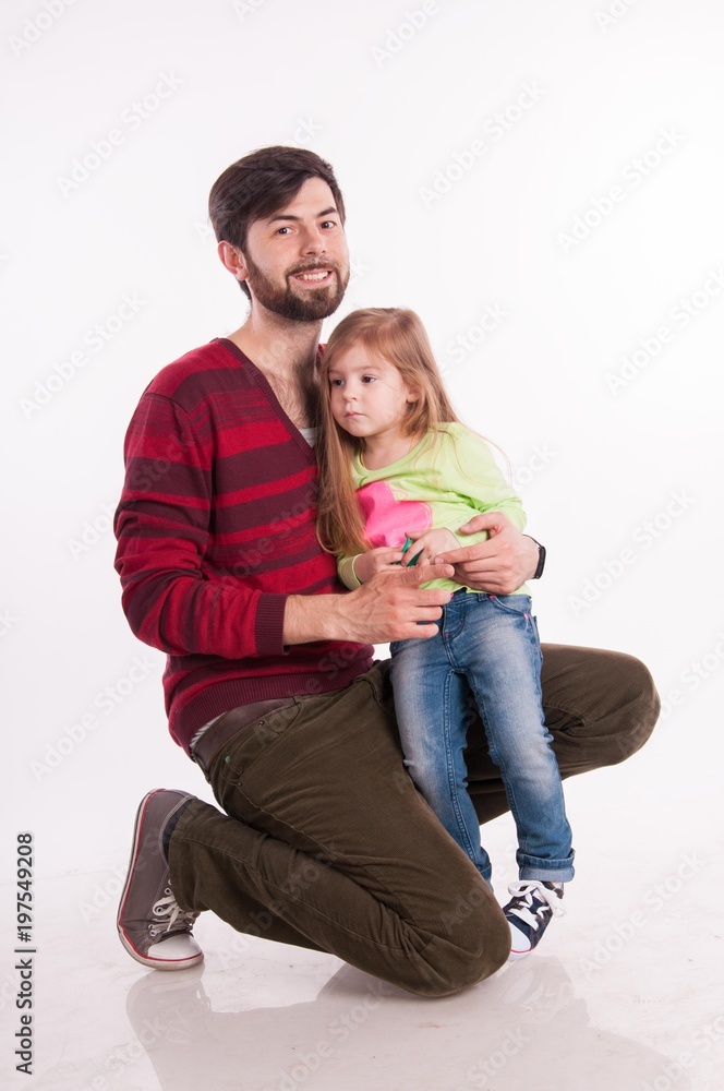 Father and daughter in the studio on a white background