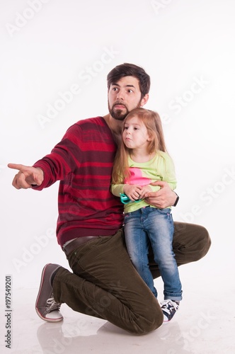 Father and daughter in the studio on a white background