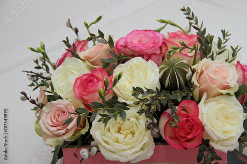 roses and exotic flower bouquet on white background  close 