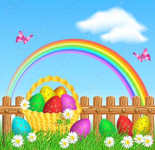 Easter eggs with golden ornament on grass and basket with easter eggs against wooden fence and rainbow