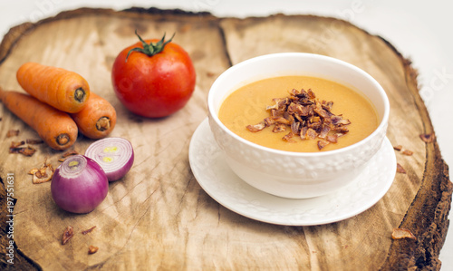 Vegan Food, Lentil Soup in White Bowl with Vegetables, on Wooden Background