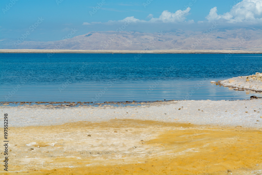 Sandy beaches of lowest salty lake in world below sea level Dead sea, Israel, landscape