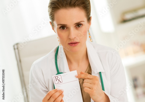 Medical doctor woman pointing on prescription