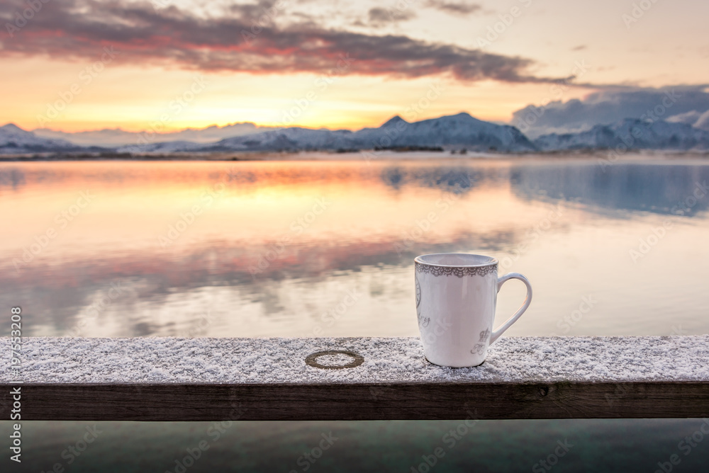 A cup of tea in the morning with a beautiful scenery in the background