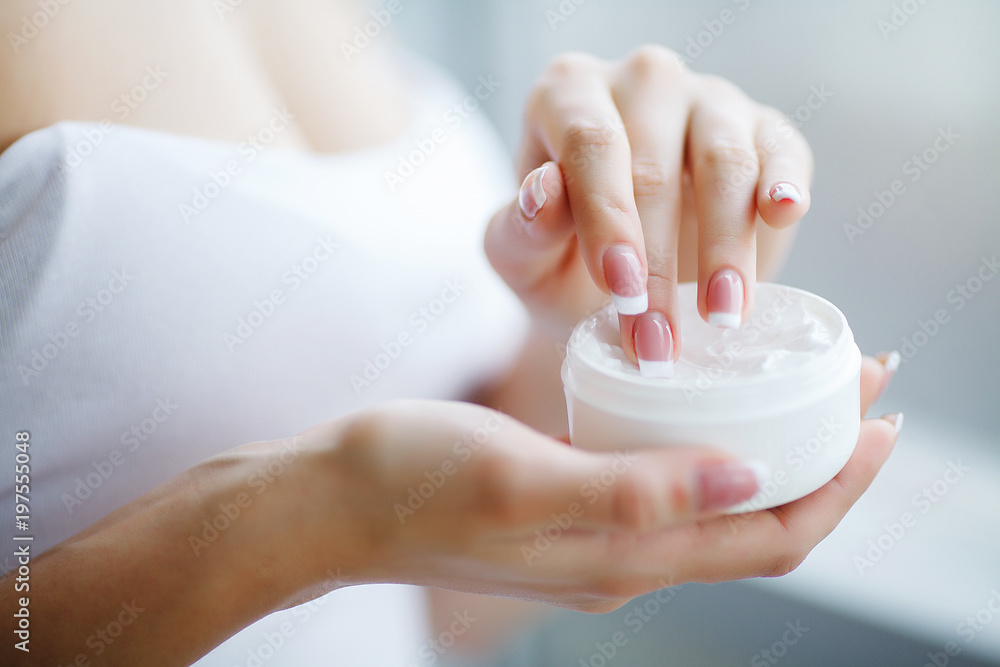 Hand Skin Care. Close Up Of Female Hands Holding Cream Tube, Beautiful Woman Hands With Natural Manicure Nails Applying Cosmetic Hand Cream On Soft Silky Healthy Skin. Hand Skin Care. Close Up Of Female Hands Holding Cream Tube, Beautiful Woman Hands With Natural Manicure Nails Applying Cosmetic Hand Cream On Soft Silky Healthy Skin.