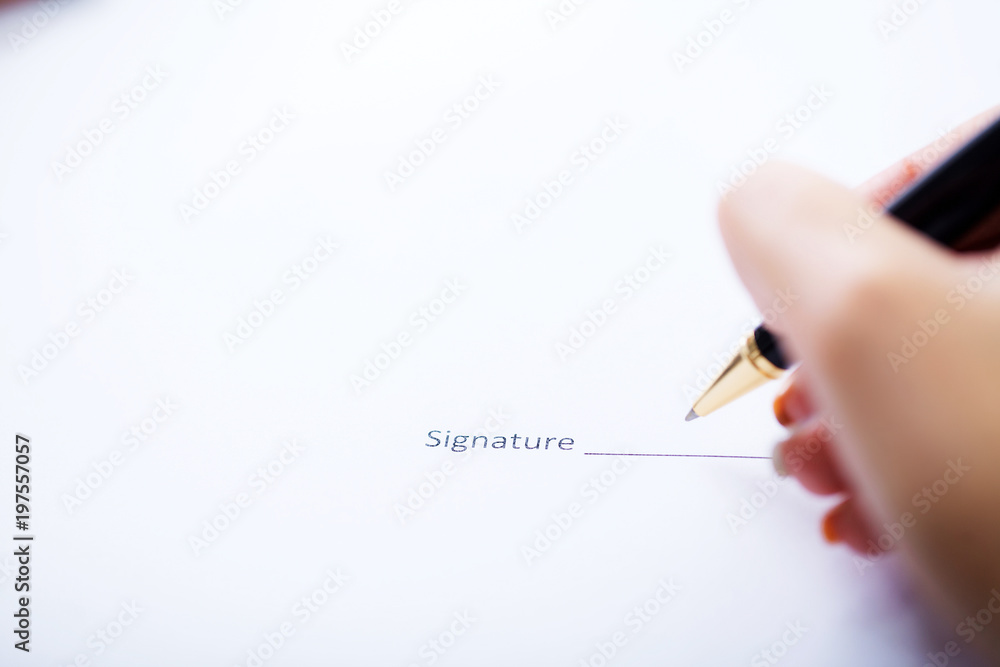 Business woman is signing a contract, business contract details Business woman is signing a contract, business contract details