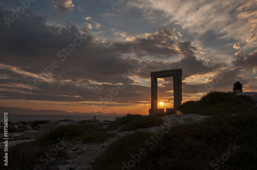 Sunset through Portara monument at Naxos island in Greece