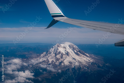 airplane wing over mountain