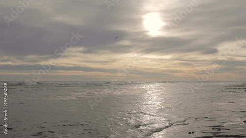 Sunset on the beach on a cloudy spring day.