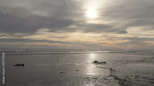 Sunset on the beach on a cloudy spring day.