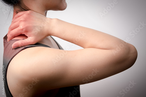 closeup women neck and shoulder pain/injury with red highlights on pain area with white backgrounds, healthcare and medical concept