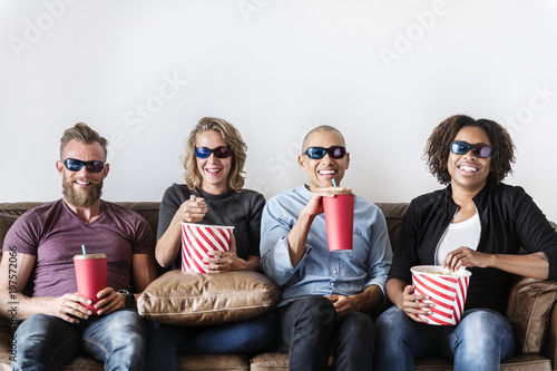 Group of friends having fun watching movie