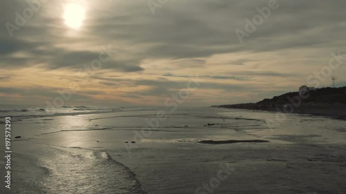 Sunset on the beach on a cloudy spring day.