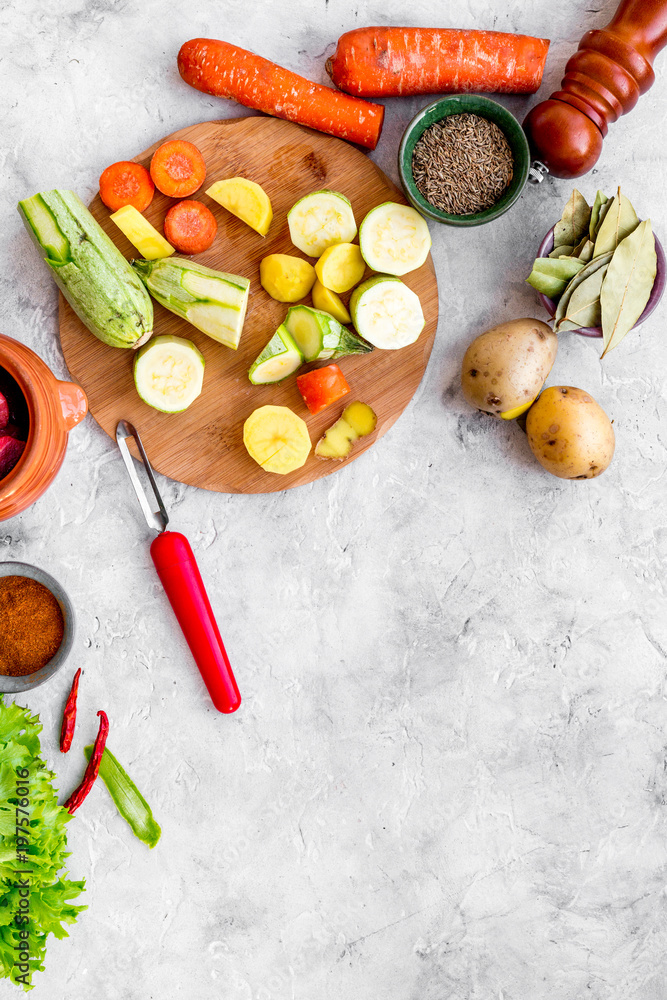 cut vegetables for cooking ragout or ratatouille for healthy dinner stone background top view mockup