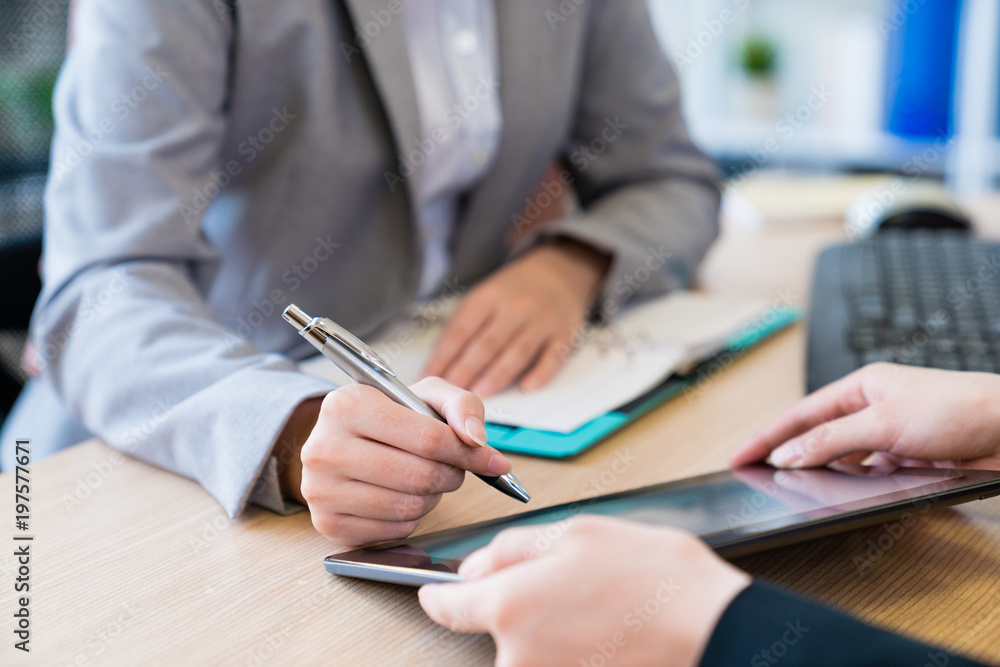 Muslim businesswoman using a tablet. Muslim businesswoman using a tablet.