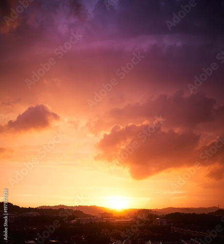 Dramatic orange and purple sunset sky . Vertical format .