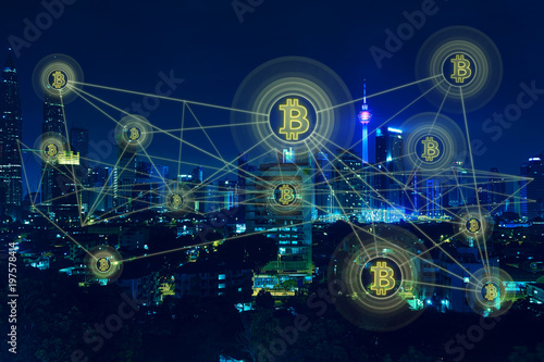 Bitcoins and blockchain network connection with night city background .Electronic money ,blockchain transfers and finance concept.