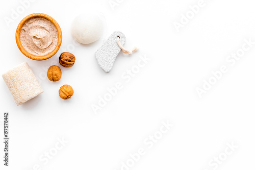 Beauty set with natural walnut scrub for spa on white background top view mockup