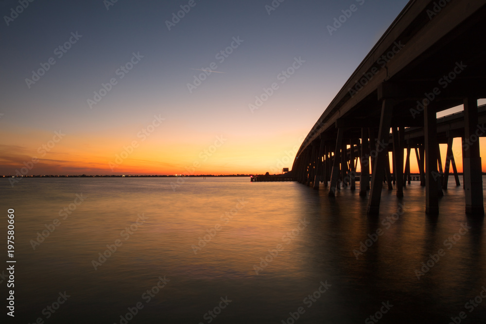 vibrant sunset beneath the bridge