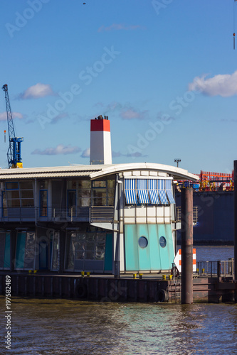 hamburg elbbruecken named river bridges container terminal docks boats and ships details and blue sky photo