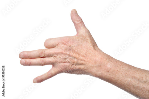 Hand of senior woman showing dog sign with fingers