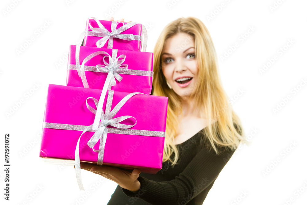 Shocked woman holding gifts Shocked woman holding gifts
