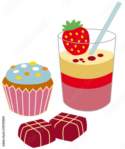 dessert including a muffin, chocolates and a pudding in a glass	