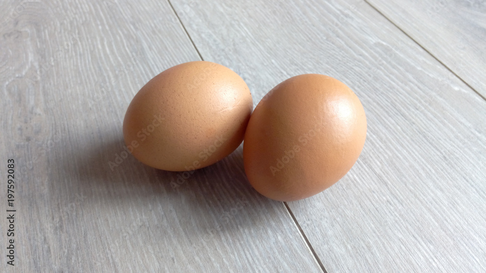 Eggs chicken close-up on a light gray table on the laminate Eggs chicken close-up on a light gray table on the laminate
