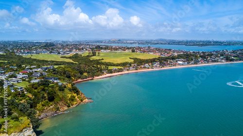 Aerial view on a residential suburb surrounded by beautiful harbor at sunny day. Auckland, New Zealand. © Dmitri