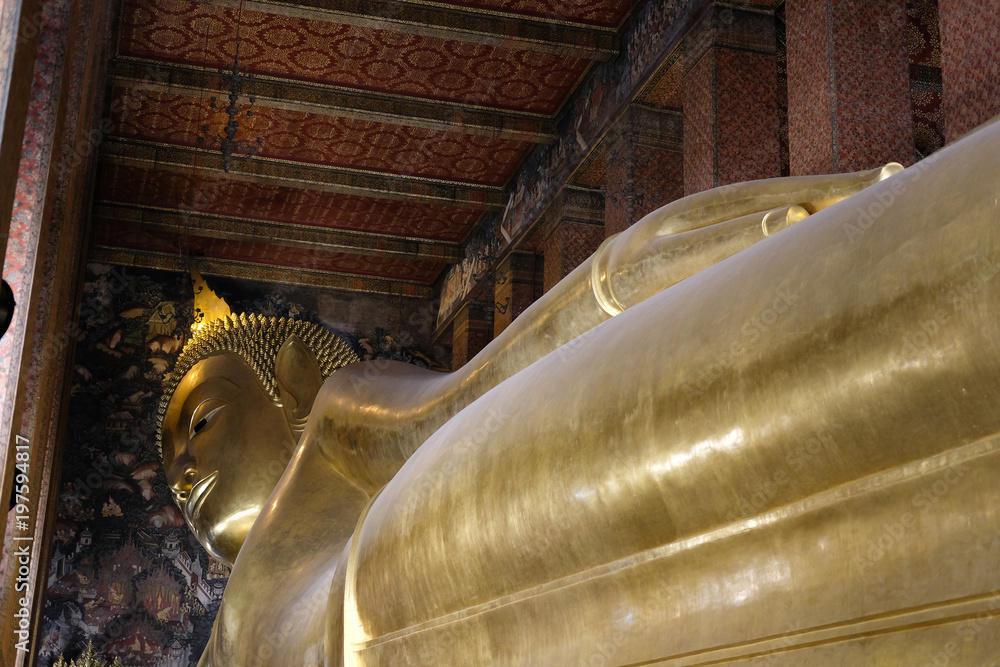 reclining golden buddha statue at wat pho in Bangkok, Thailand
