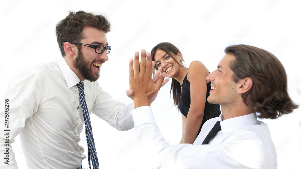 business colleagues giving each other high five. business colleagues giving each other high five.